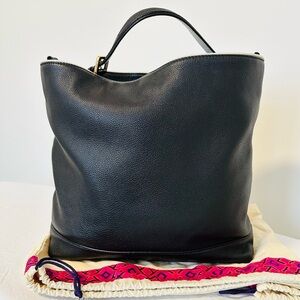 Authentic Tory Burch black pebble leather hobo bag in excellent used condition.